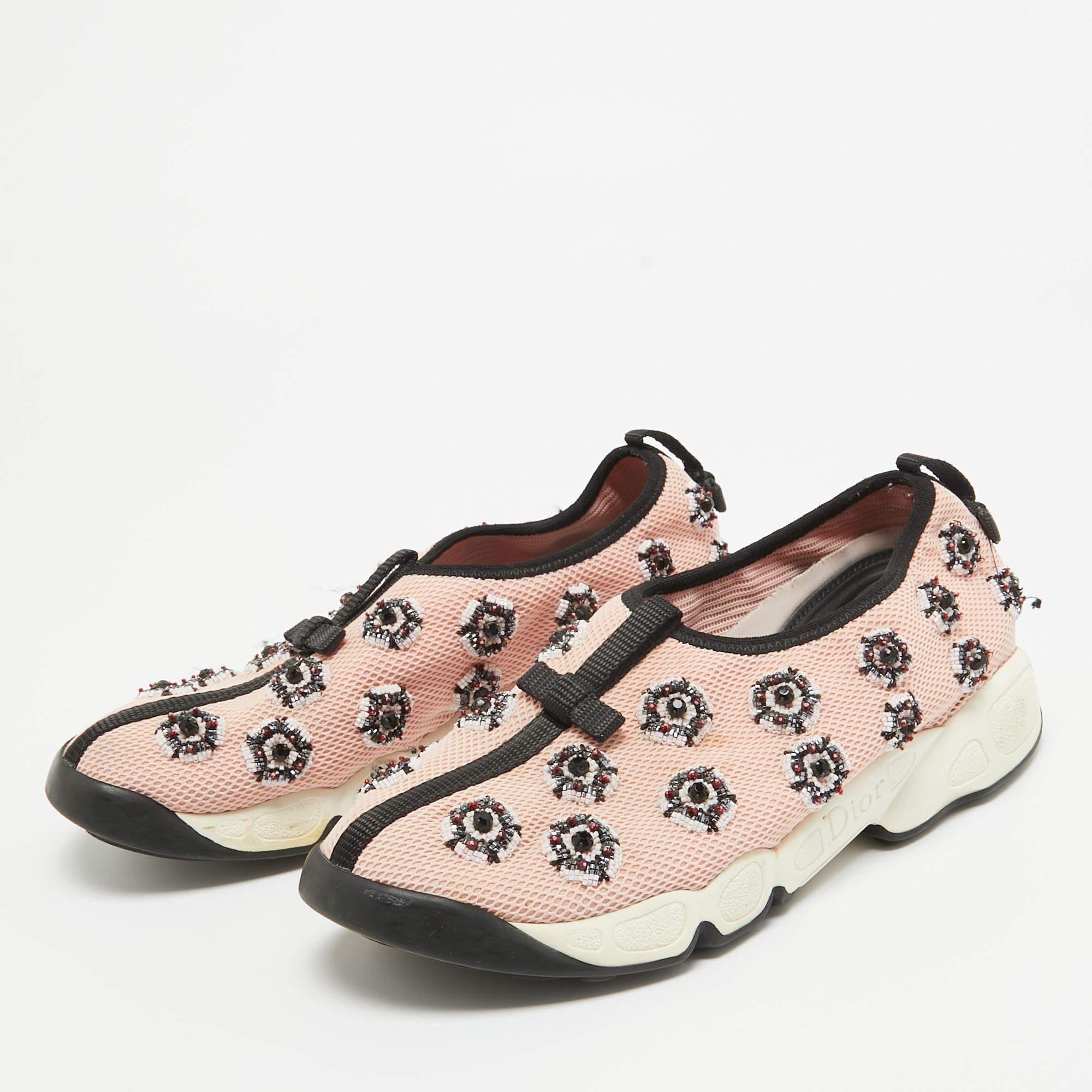 Coming in a classic silhouette, these designer sneakers are a seamless combination of luxury, comfort, and style. These sneakers are finished with signature details and comfortable insoles.