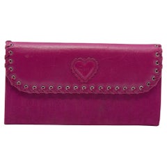 Portefeuille continental à rabat oblique en toile et garniture en cuir Dior rose