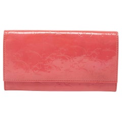Dior - Portefeuille continental rose oblique en cuir verni embossé