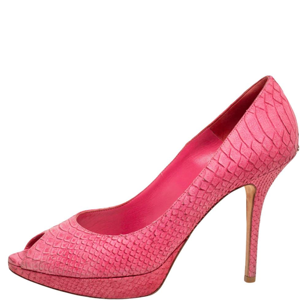 The Miss Dior collection from Dior is a significant creation that continues to attract everyone with its impeccable style. These Miss Dior pumps are created from python-embossed leather and feature peep-toes, platforms, and high heels. Step out
