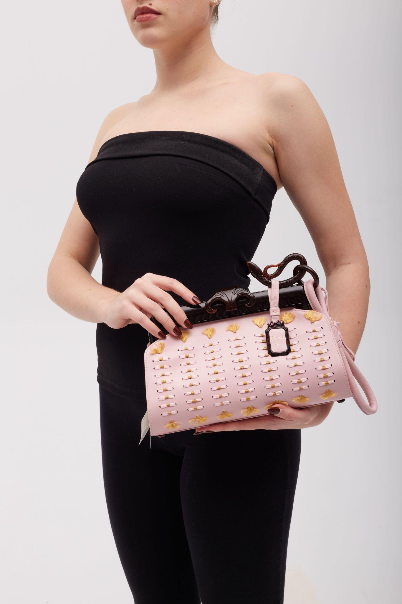 Color: pink
Material: leather with embellishments
Limited edition bag, code 0150
Date code: 11-MA-0077
Year: 2007
Comes with: Dust bag
Condition: Very good. Faint indentations to leather, light residue and faint marks.
Made in