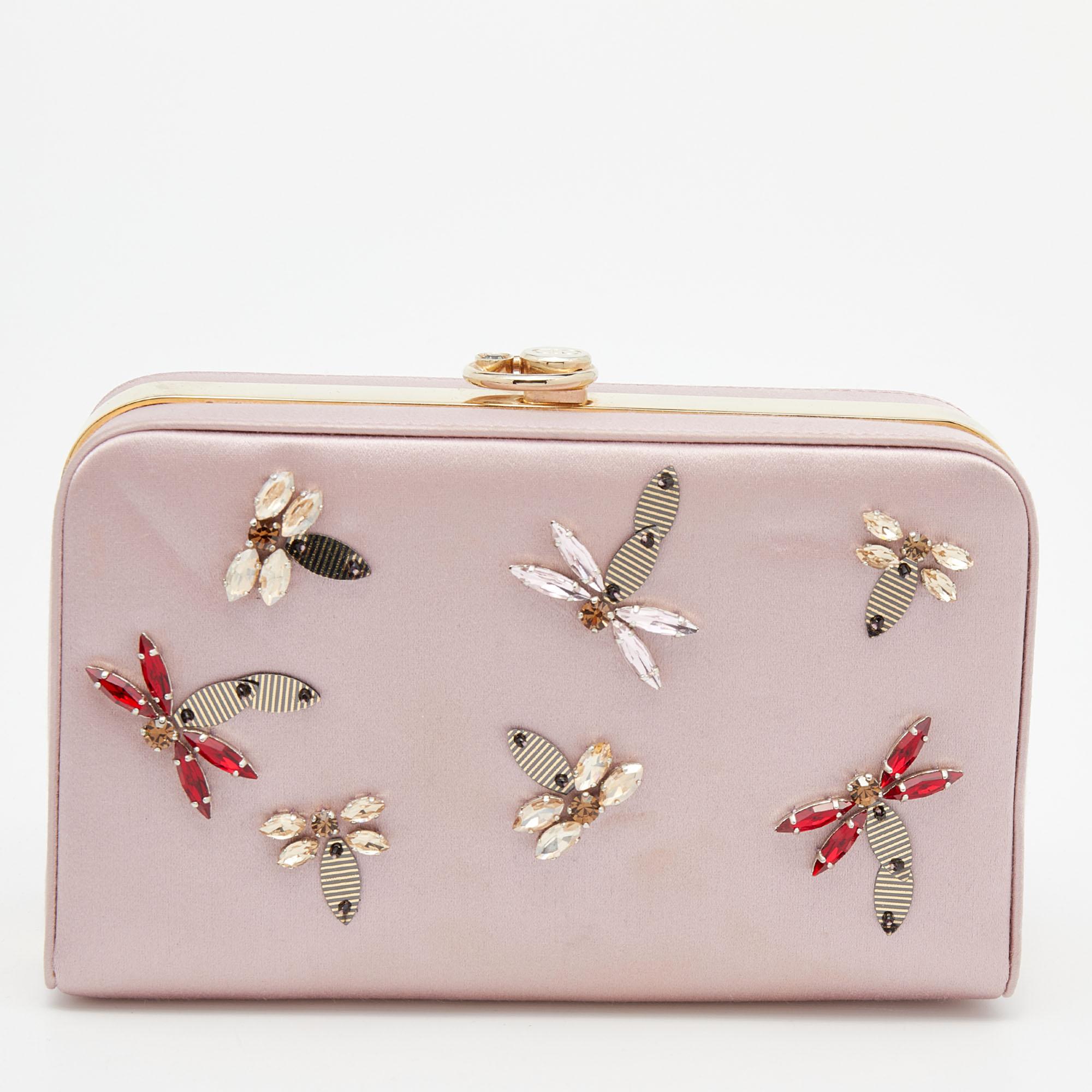 This clutch from Dior has been made using satin into a simple shape and elevated with colorful crystal embellishments. It has a lined interior secured by a top clasp.

Includes: Authenticity Card, Info Booklet
