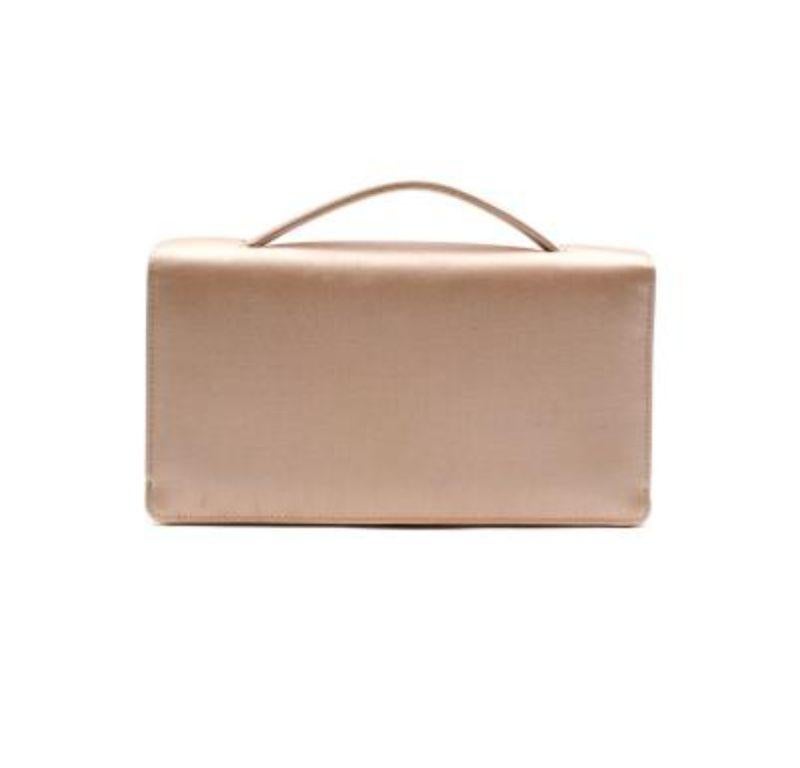 Dior Nude Pink Satin Clutch with Embellished Bee Clasp

- Pale pink satin clutch bag with embellished gold-tone bee clasp 
- Small top handle 
- 3 internal compartments 

Made in Italy 

Great condition other than cosmetic marks on the front