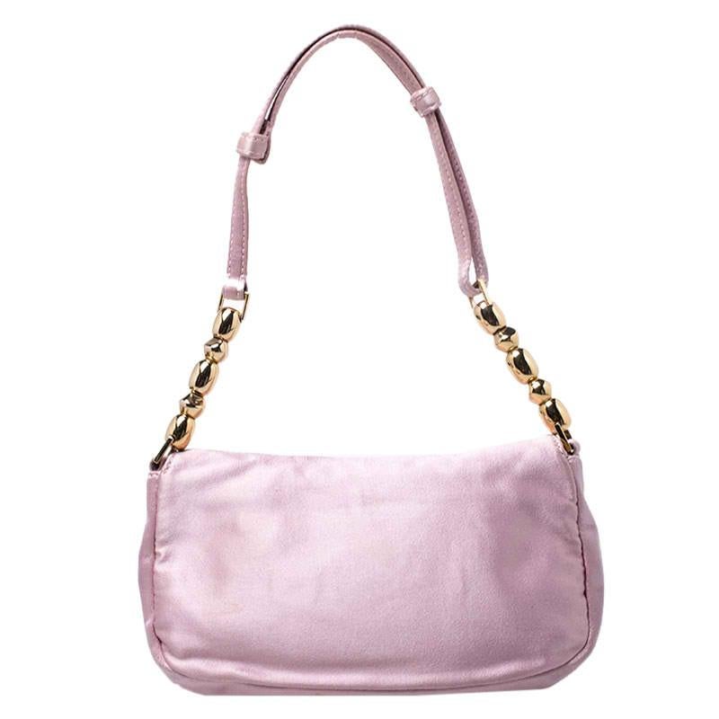 This beautifully fashioned satin bag will surely fetch you a lot of admiration. This piece has a single handle and an ideally-sized fabric interior. You are sure to love this absolutely stylish accessory from Dior.

Includes: Original Dustbag,