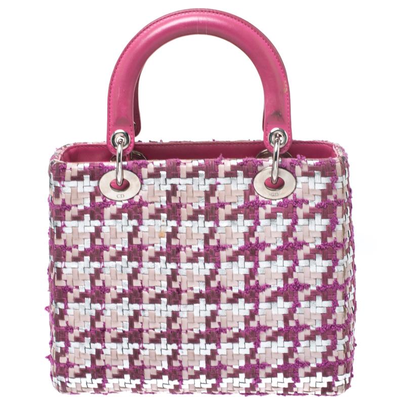 The Lady Dior tote is a Dior creation that has gained recognition worldwide and is today a coveted bag that every fashionista craves to possess. This pink tote has been crafted from tweed and leather and it carries a woven exterior which forms an