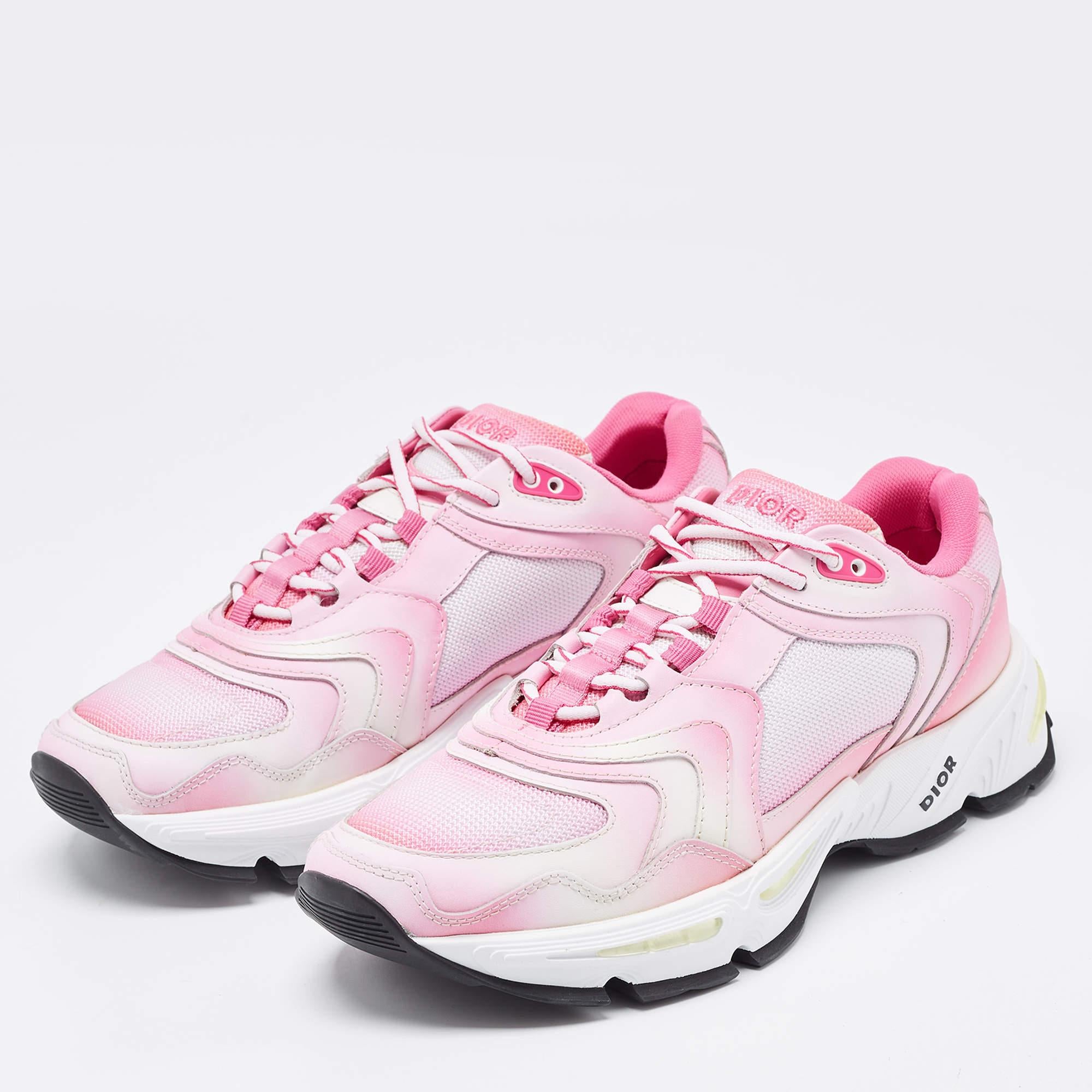 Upgrade your style with these Dior pink/white sneakers. Meticulously designed for fashion and comfort, they're the ideal choice for a trendy and comfortable stride.

