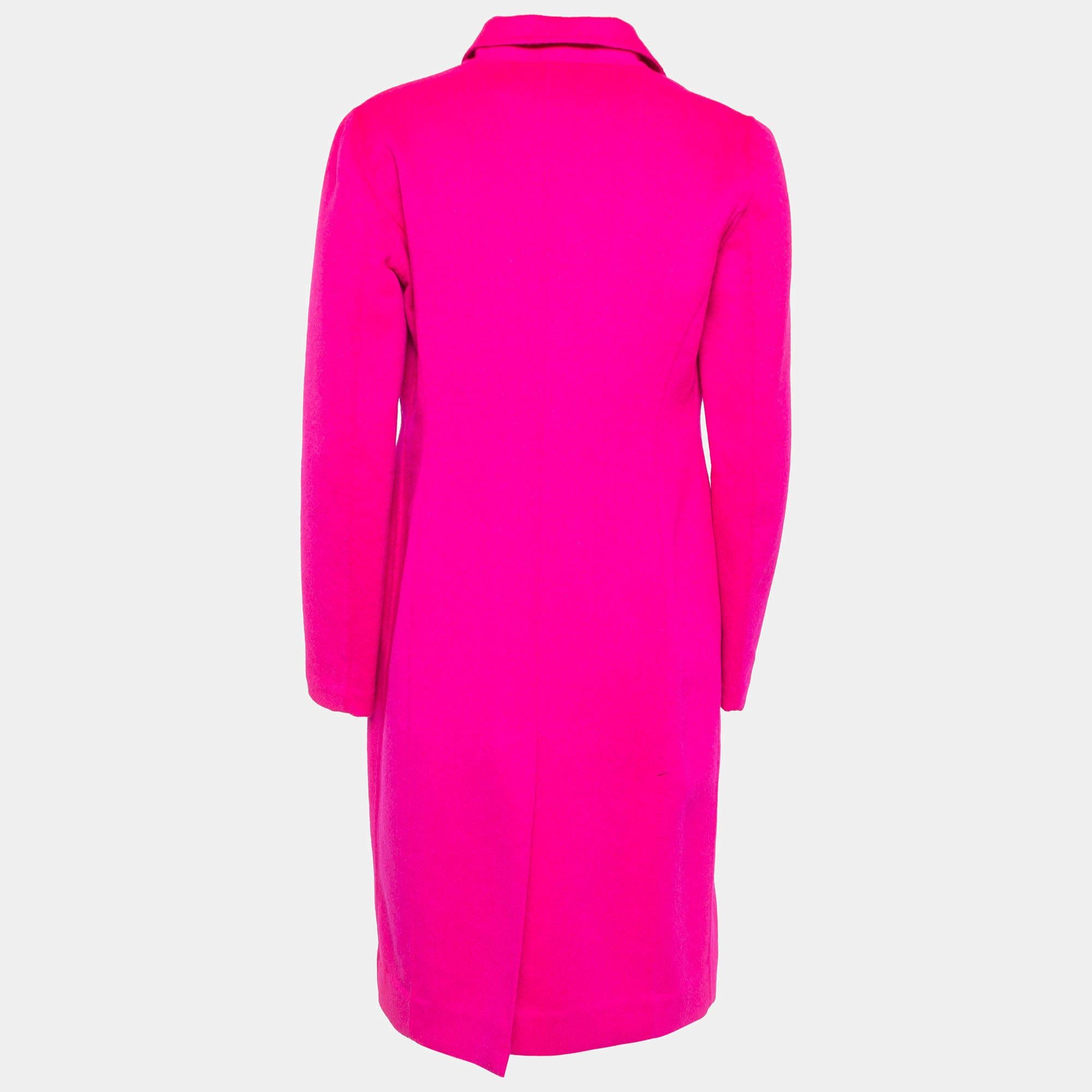 Envelop yourself in the timeless charm of the Dior coat. Crafted with finesse, its soft wool blend fabric drapes gracefully, while the double-breasted design adds a touch of classic sophistication. This coat effortlessly blends warmth with style,