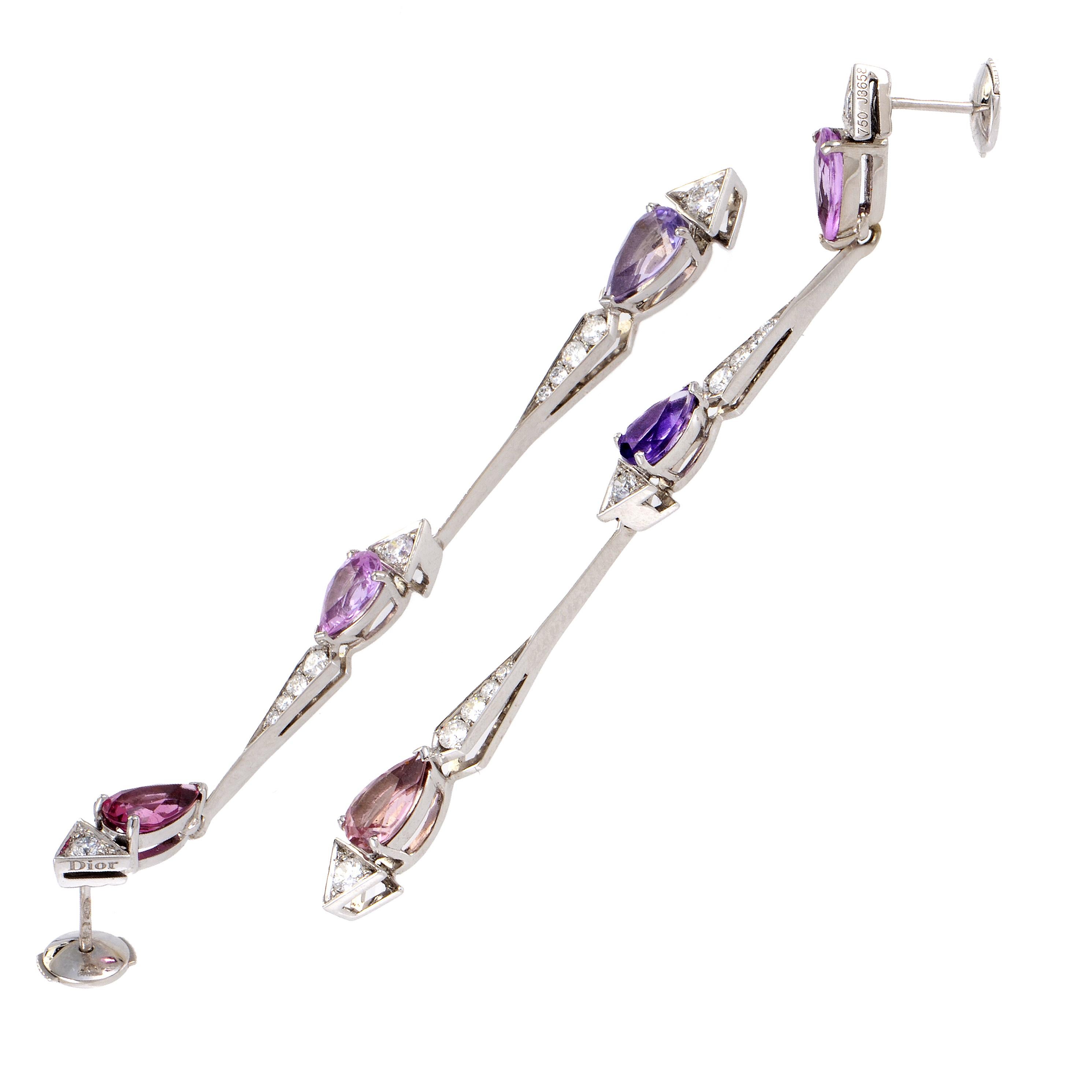 The exquisite shapes and precious colors of enchanting gems produce a spellbinding allure in these gorgeous 18K white gold earrings from Dior which boast neat tourmalines totaling 1.45 carats, adorable pink sapphires amounting to 1.37 carats and