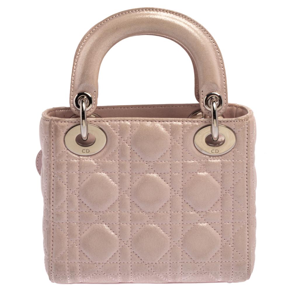 The Lady Dior tote is a Dior creation that has gained recognition worldwide and is today a coveted bag that every fashionista craves to possess. This pink tote has been crafted from shimmering leather and it carries the signature Cannage quilt. It