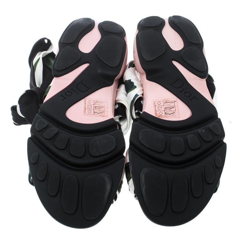 The trend essayed by these sandals from Dior is one you must try. They are designed with printed satin straps that end as wraps around the ankle and rubber soles detailed with the brand logo. They are high in comfort and style, just perfect to be