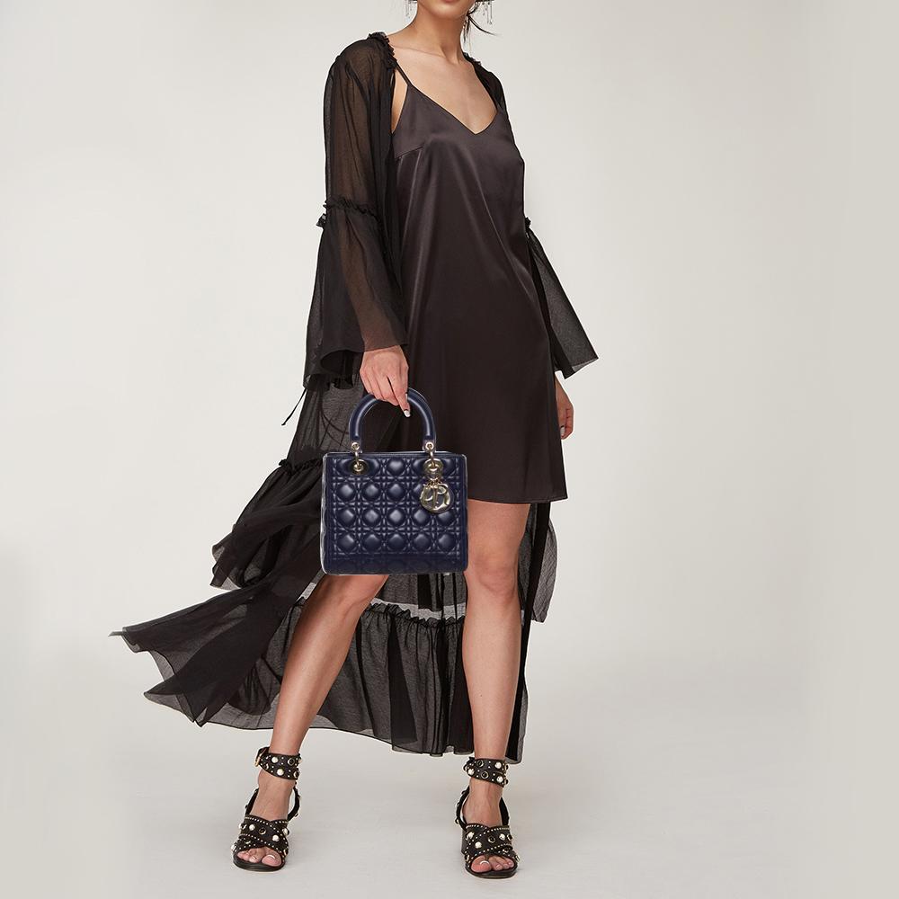 The Lady Dior tote is a Dior creation that has gained recognition worldwide and is today a coveted bag that every fashionista craves to possess. This purple tote has been crafted from leather and carries the signature Cannage quilt. It is equipped