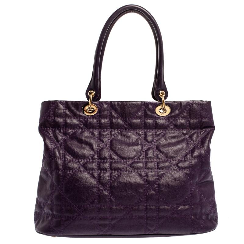 The Lady Dior tote is a Dior creation that has gained recognition worldwide and is today a coveted bag that every fashionista craves to possess. This purple tote has been crafted from coated canvas leather and it carries the signature Cannage quilt.