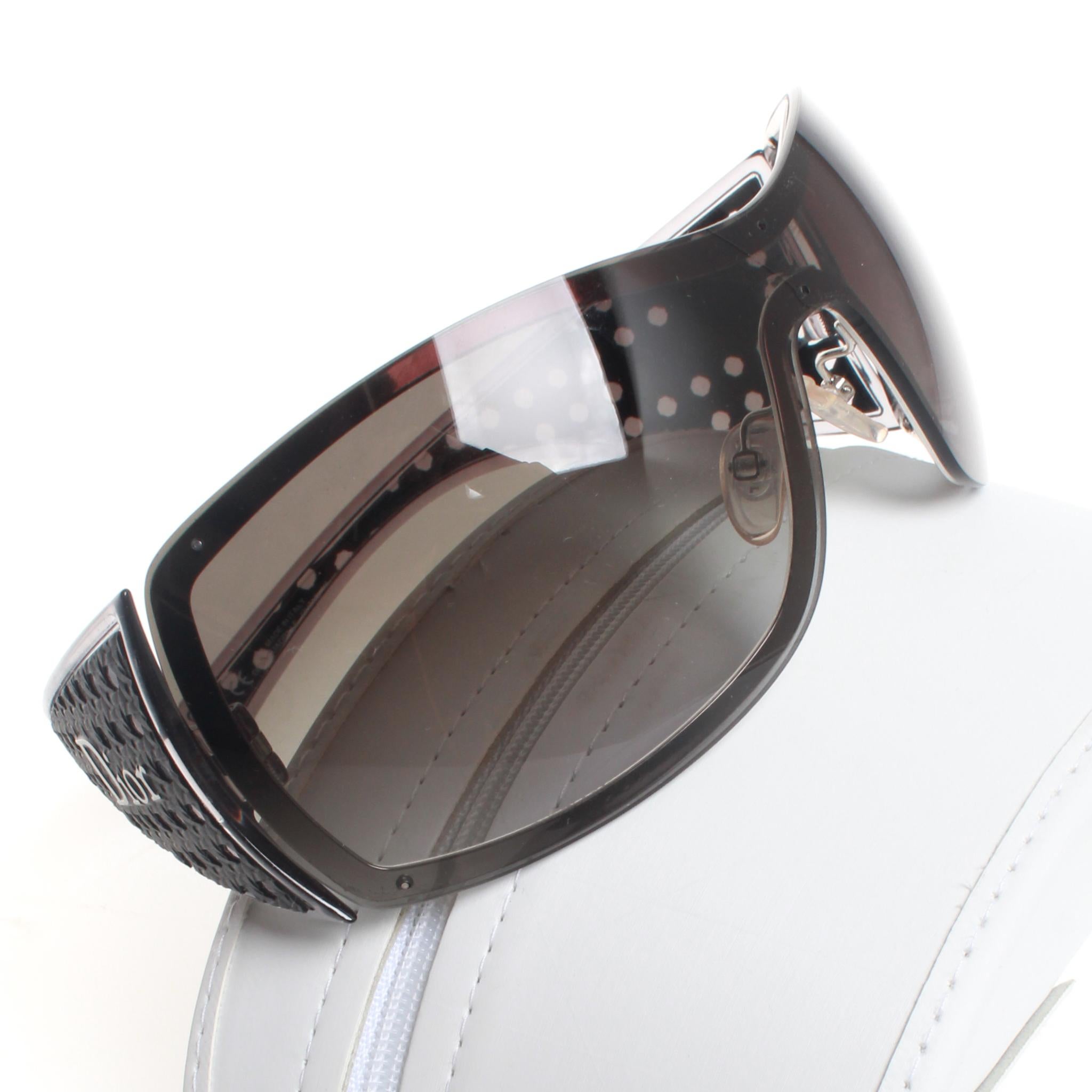 Vintage DIOR Quadrille logo wrap shield sunglasses with subtle grey gradient lens and woven style embellishment on extra wide arms. 
Comes in original box. 