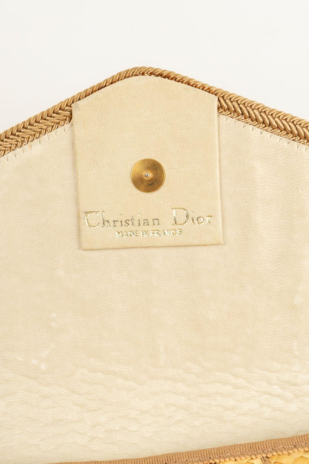 dior straw clutch
