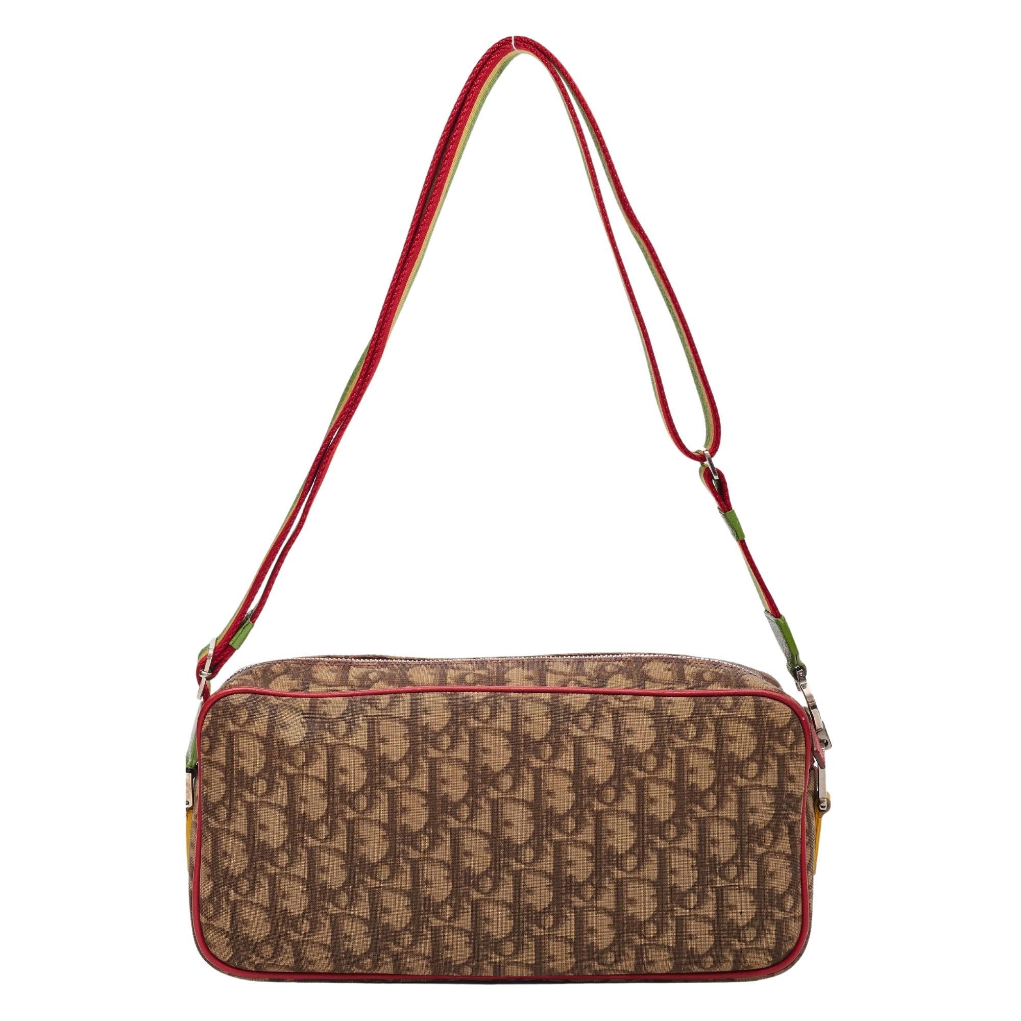 Color: brown monogram oblique with rasta pattern finishes
Material: Coated canvas
Date code: 05-MA-0094
Year 2004
Height 5” x Length 11” x Depth 2.5”
Comes with: Dust bag
Condition: The item shows signs of wear and use. Surface scratches, slight