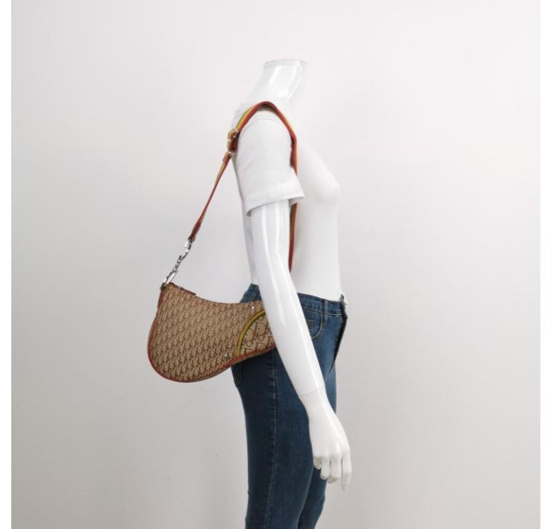 Dior Rasta Trotter Saddle Crossbody Bag Multicolor Canvas Strap
These are professional photos of the actual bag.
  Discover the sophistication and elegance of Dior with the Rasta Trotter Double Saddle Shoulder Bag in stunning red. Its oblique