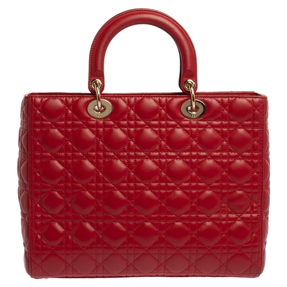 The Lady Dior tote is a Dior creation that has gained recognition worldwide and is today a coveted bag that every fashionista craves to possess. This red tote has been crafted from leather and it carries the signature Cannage quilt. It is equipped