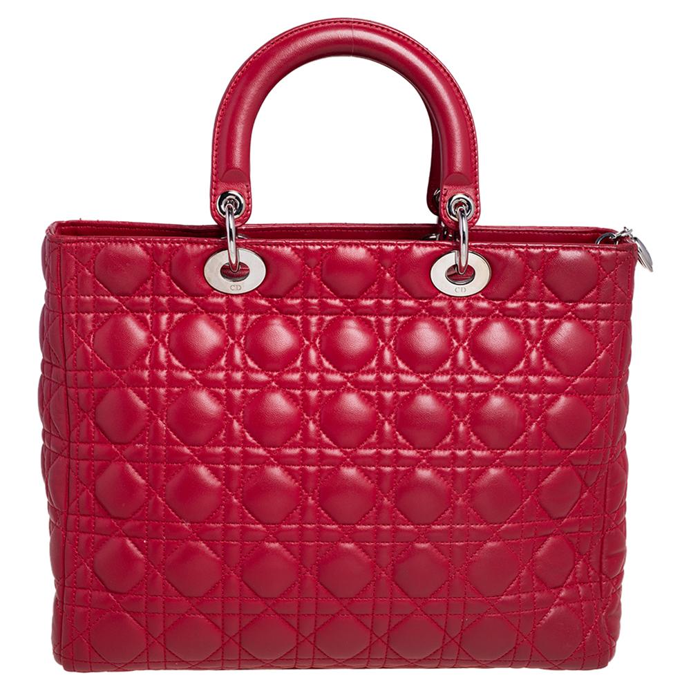 The Lady Dior tote is a Dior creation that has gained recognition worldwide and is today a coveted bag that every fashionista craves to possess. This red-hued tote has been crafted from leather and it carries the signature Cannage quilt. It is