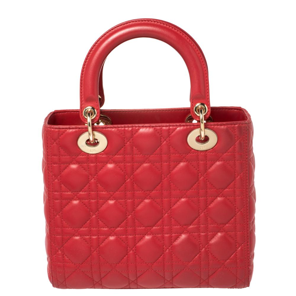The Lady Dior tote is a Dior creation that has gained recognition worldwide and is today a coveted bag that every fashionista craves to possess. This Red tote has been crafted from leather and it carries the signature Cannage quilt. It is equipped