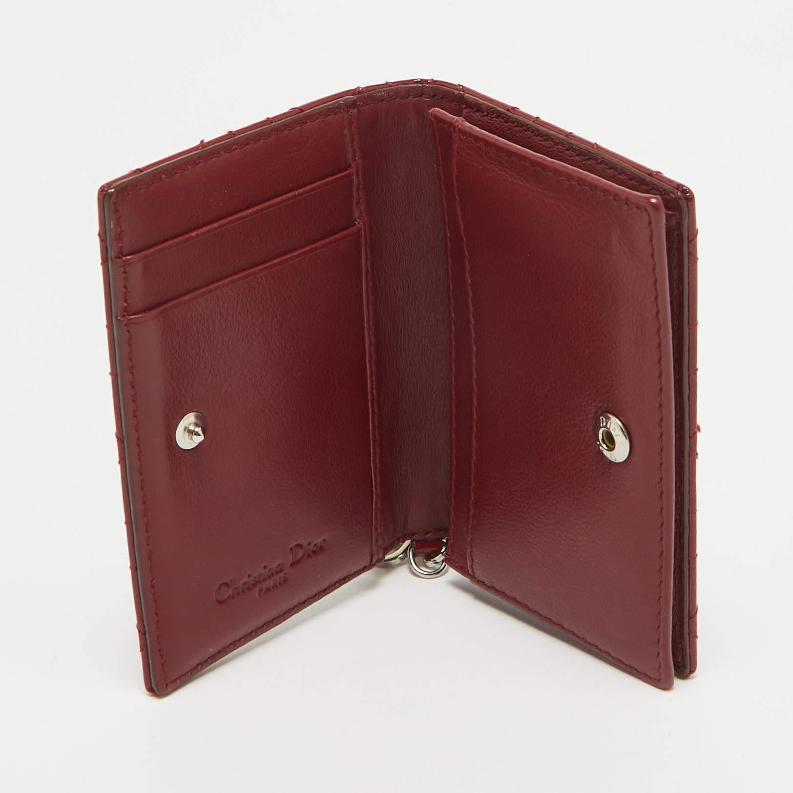 Crafted to perfection this Dior card holder is both beautiful and functional. Shaped well the black piece has multiple slots compartments and Dior letter charms. It is sized to hold your cards with ease and also fit into your handbags.