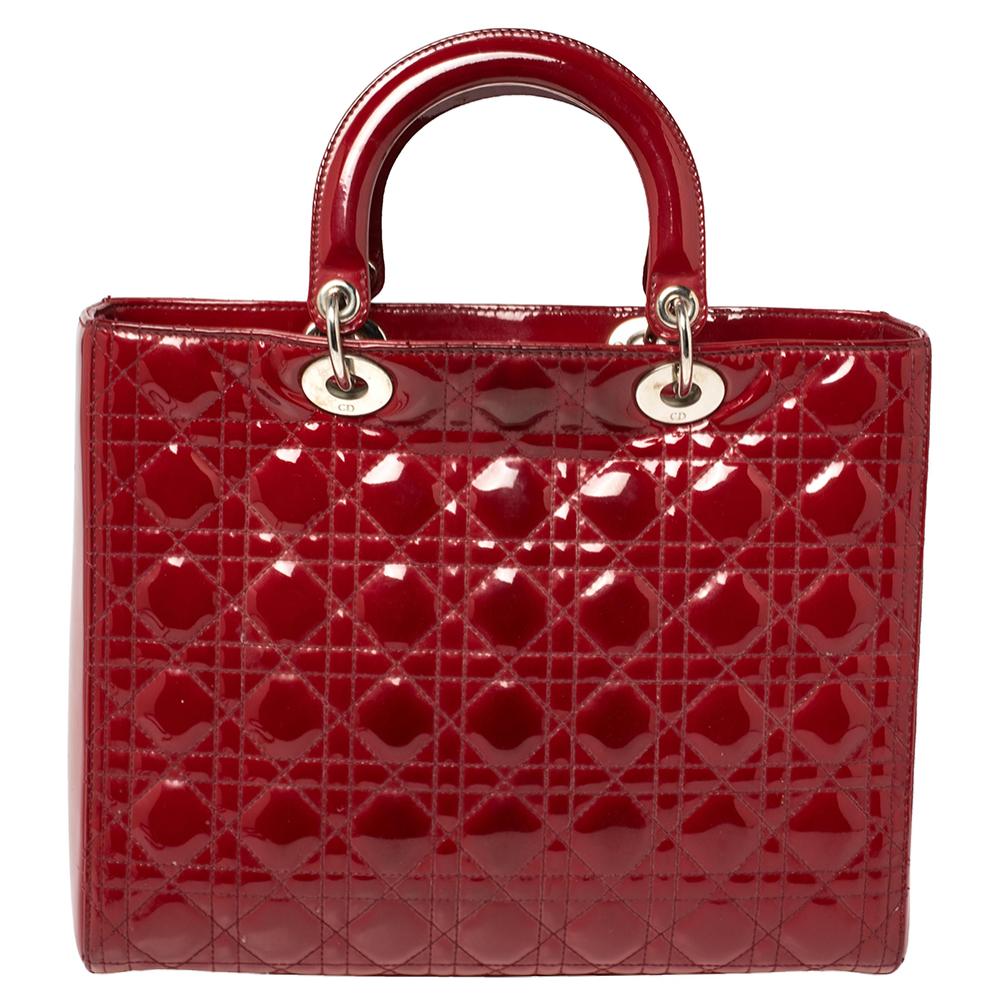 The Lady Dior tote is a Dior creation that has gained recognition worldwide and is today a coveted bag that every fashionista craves to possess. This red tote has been crafted from patent leather and it carries the signature Cannage quilt. It is