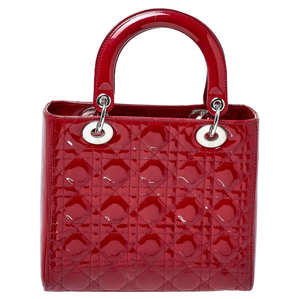 The Lady Dior tote is a Dior creation that has gained recognition worldwide and is today a coveted bag that every fashionista craves to possess. This red tote has been crafted from patent leather and it carries the signature Cannage quilt. It is