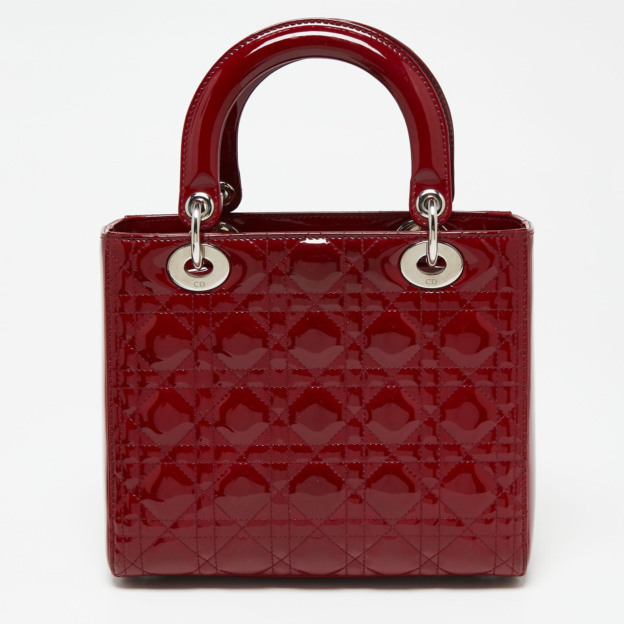 The Lady Dior tote is a Dior creation that has gained recognition worldwide and is today a coveted bag that every fashionista craves to possess. This red tote has been crafted from patent leather and it carries the signature Cannage quilt. It is