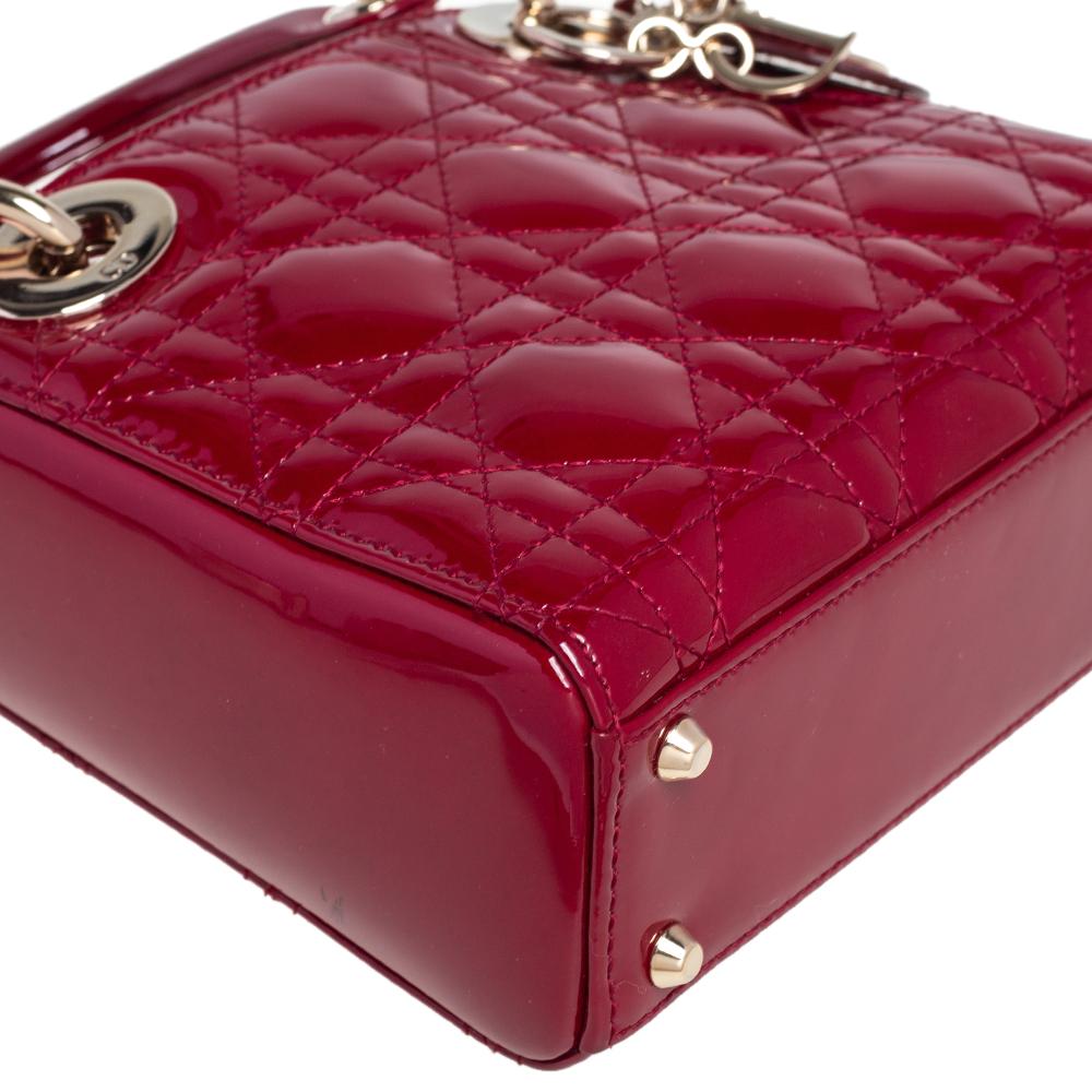 The Lady Dior tote is a Dior creation that has gained recognition worldwide and is today a coveted bag that every fashionista craves to possess. This mini-sized red tote has been crafted from patent leather and it carries the signature Cannage