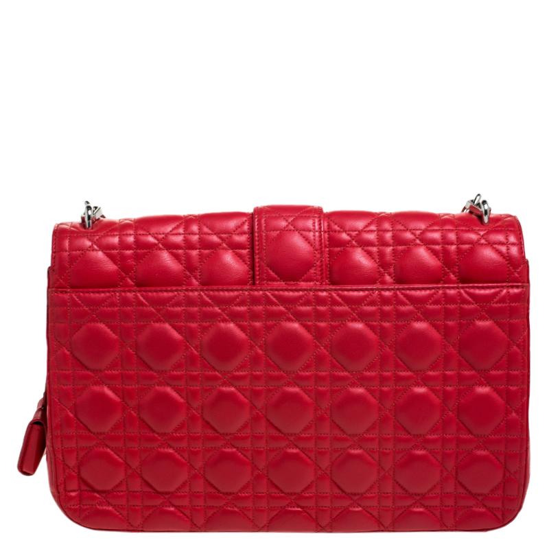 Flap bags like this Miss Dior will never go out of style. Crafted from leather, this Dior flap bag features a red Cannage exterior and a chain strap. The front flap has a Dior lock that opens to a leather-lined interior with enough space to keep