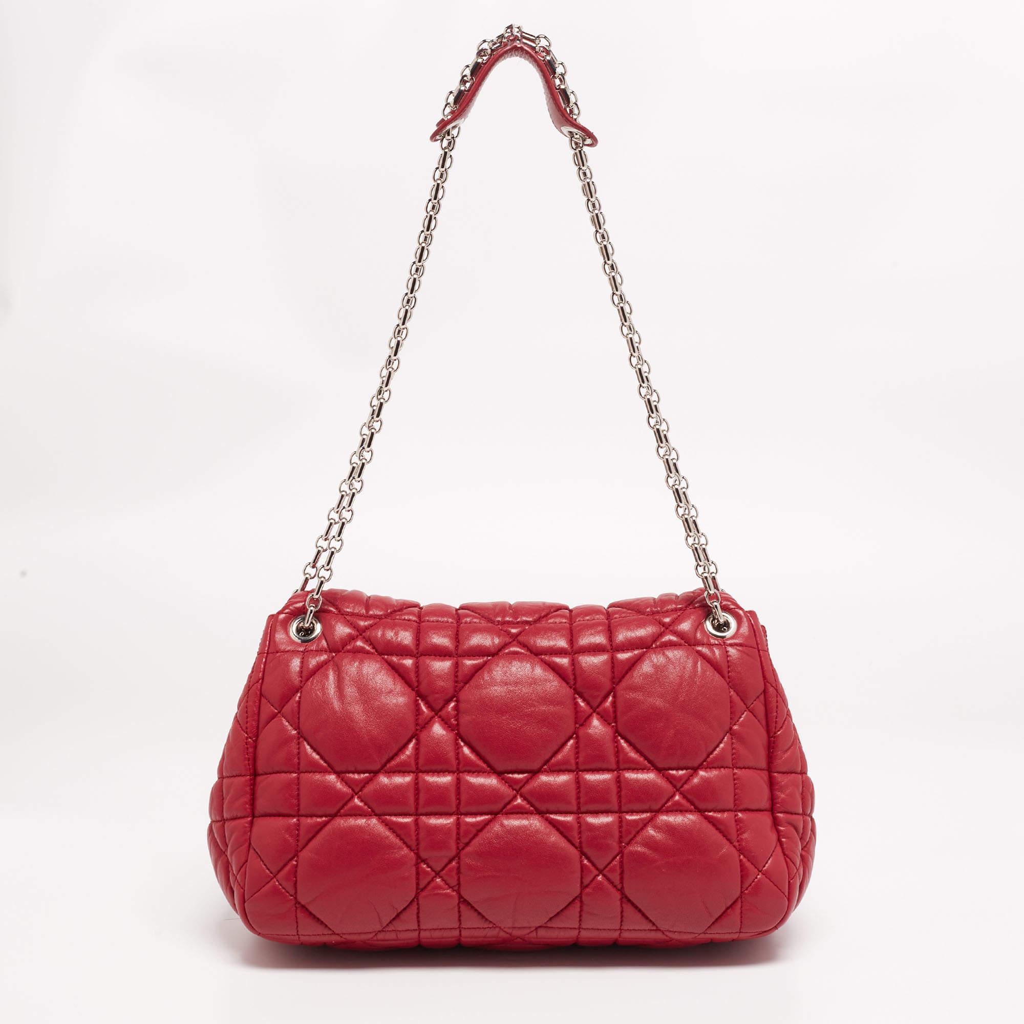 This Dior Milly La Forêt bag is made of Cannage soft leather and held by a chain-link handle. This bright red bag has a turn-lock that opens to reveal a spacious satin-lined interior and a zip compartment.

Includes: Original Dustbag, Authenticity
