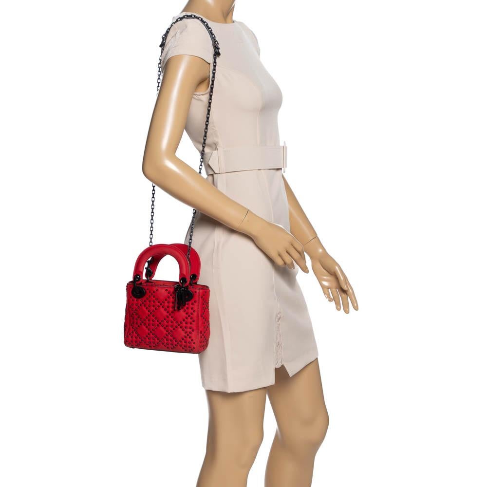 The Lady Dior tote is a Dior creation that has gained recognition worldwide and is today a coveted bag that every fashionista craves to possess. This red tote has been crafted from leather and it carries the signature Cannage pattern achieved