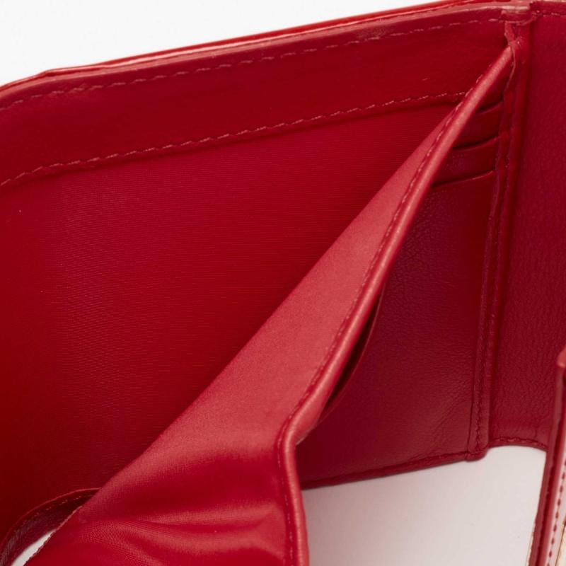 This compact and durable wallet from Dior is a good purchase. It has a red patent leather exterior and a well-equipped interior to house all your necessities in proper order.

Includes: Original Box