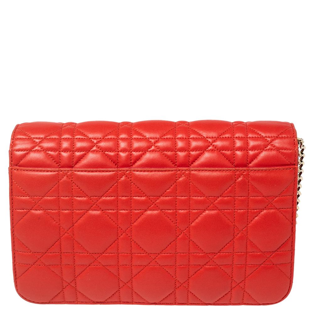 This Miss Dior Promenade clutch bag by Dior, with its luxurious design, will be a favorite. Crafted from leather, it is adorned with quilted details and gold-tone hardware. This bag features a shoulder chain to keep your hands free.

Includes: