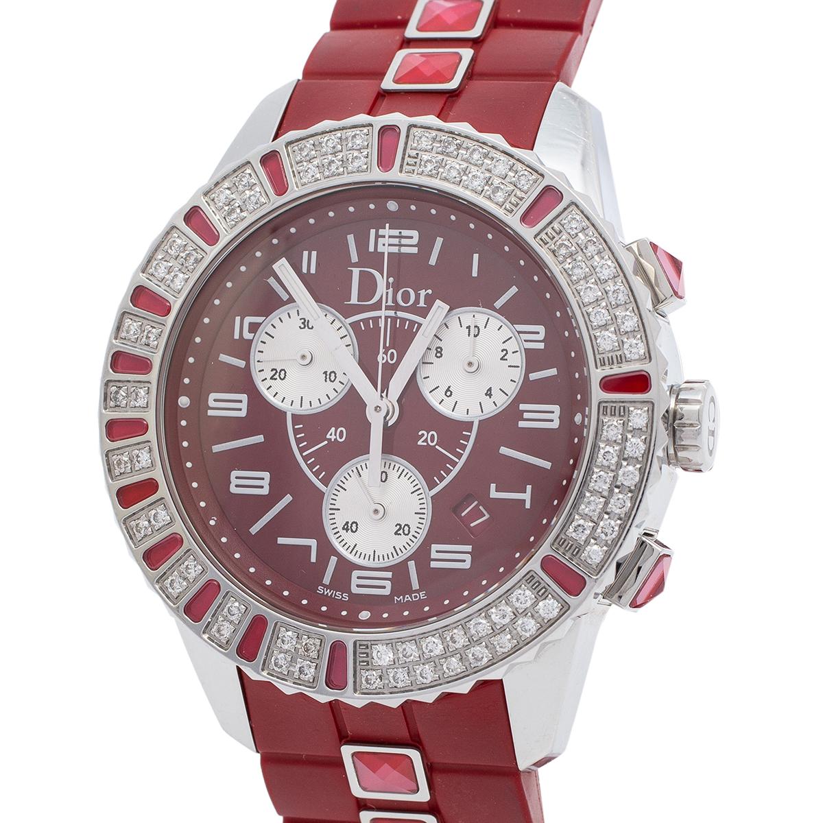 Here's a timepiece to not only assist you with the correct time but also elevate your style quotient. This Dior watch is from their Christal collection, and it is Swiss-made. It is made of stainless steel and embellished with diamonds. The red dial