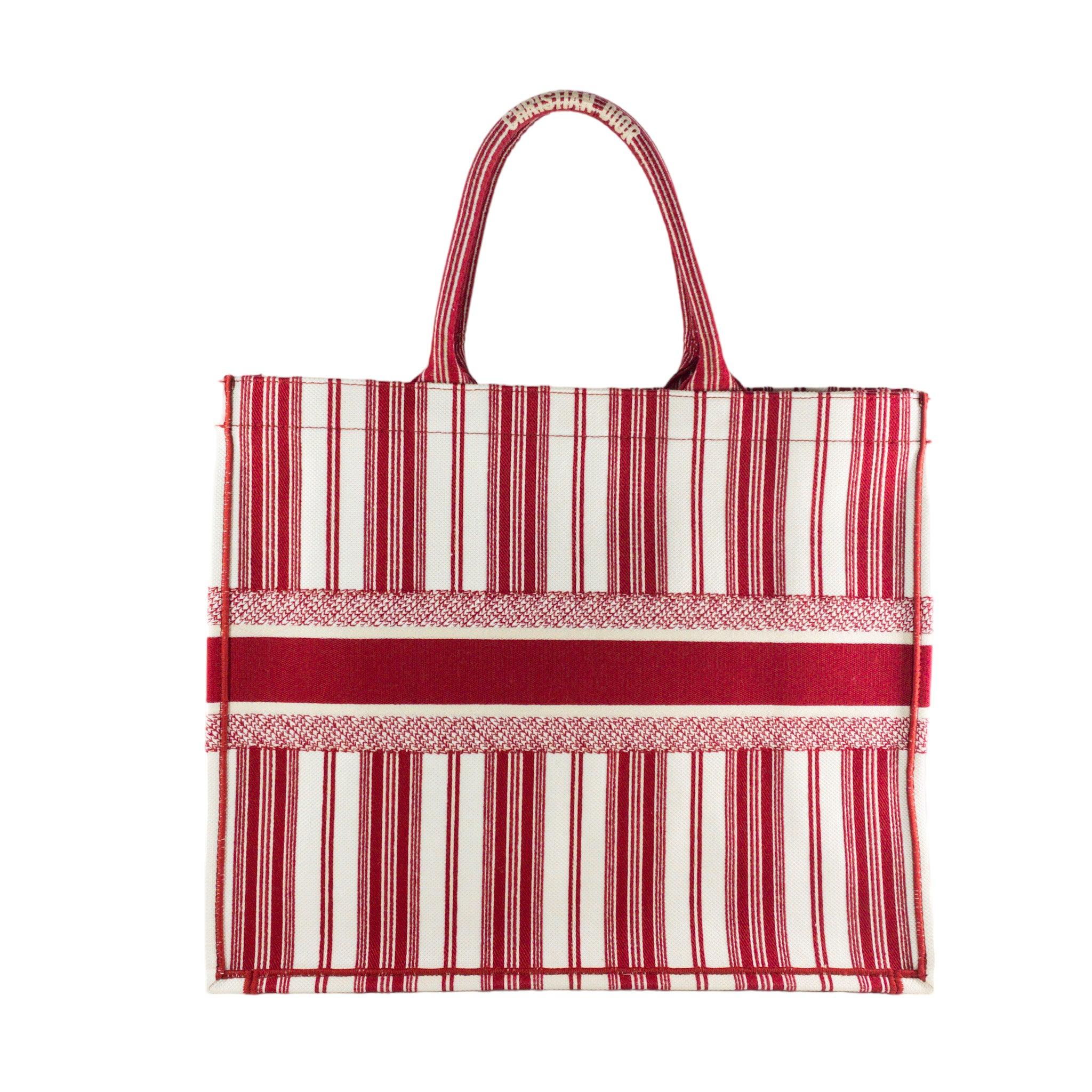 Dior Red Striped Embroidered Large Book Tote Bag

This is an Authentic Dior Book Tote in size Large. Striped embroidered canvas in red and white 'Christian Dior' in front with large stationary top handles. Large interior cavity. Unlined

Additional