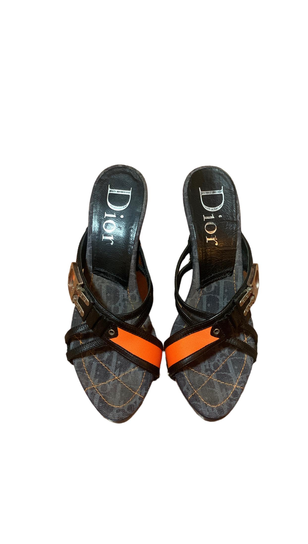 Step into the world of timeless elegance with these vintage Christian Dior Flight Line Monogram Denim Mules. Crafted with a perfect blend of leather and denim, these mules feature the iconic monogram design discreetly on the inside sole. Their