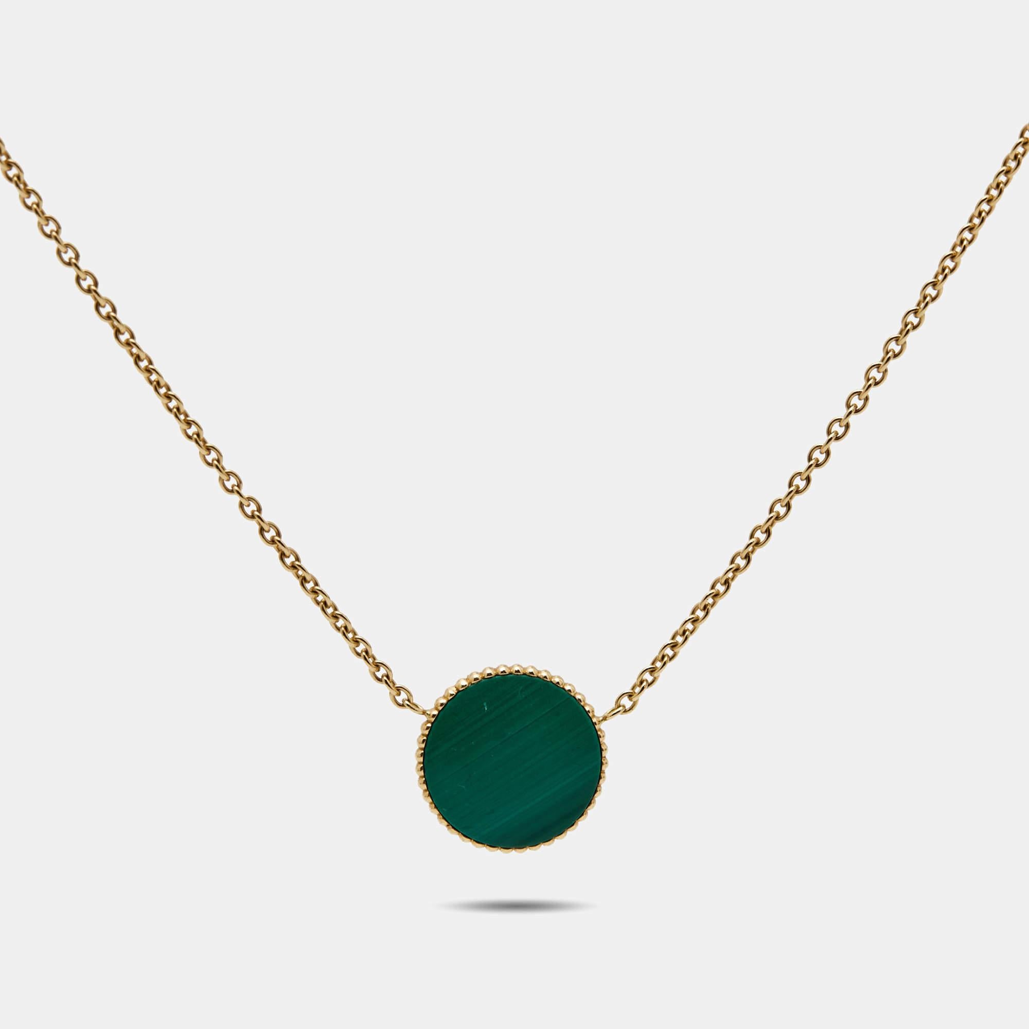 This Rose des Vents necklace by Dior exhibits the talisman star as its main highlight. The necklace's design features a round pendant inlaid with malachite and outlined with 18k yellow gold beaded borders. The motif is further accented with a gold