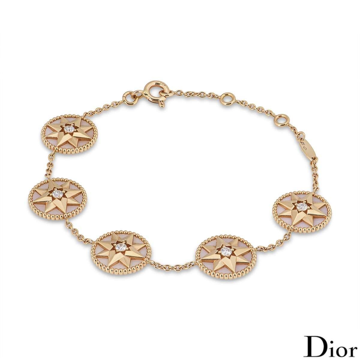 An 18k rose gold diamond and pink opal Dior bracelet from the Rose des Vents collection. The bracelet features 5 pink opal circular motifs, each with a rose gold star in the centre and round brilliant cut diamonds totalling approximately 0.21ct. The