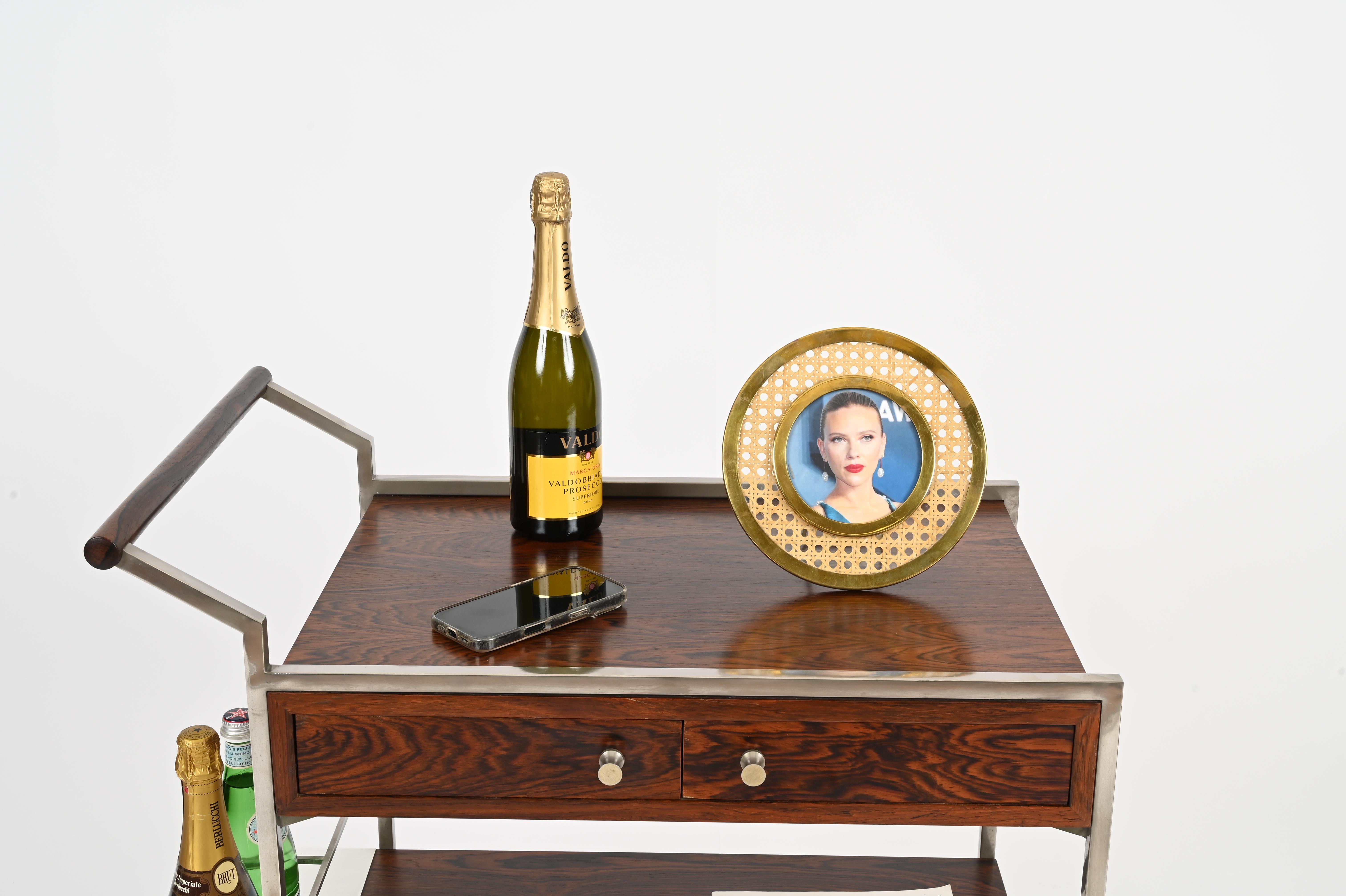 Stunning round picture frame made of golden brass and Lucite, enriched inside with Vienna straw. This incredibly stylish photo frame is attributed to a Dior Home design and was produced in Italy in the early 1970s.

In amazing condition, with no