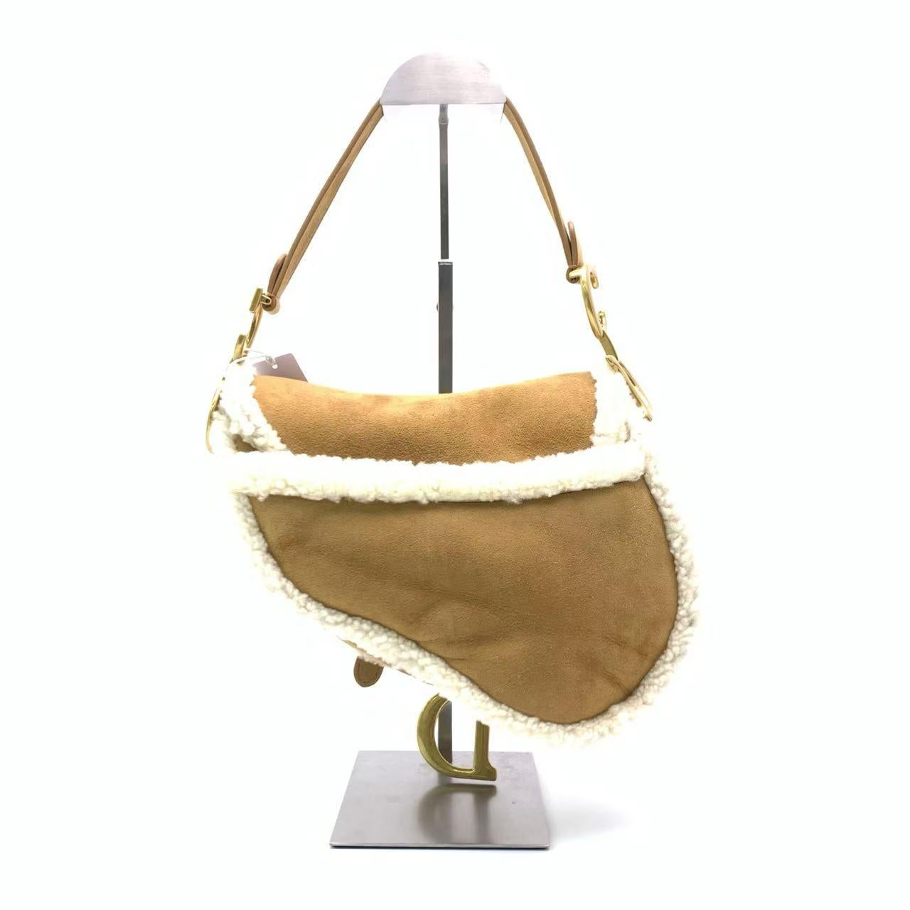 Dior Saddle 2020 Shoulder Bag Shearling Brown and While
 These are professional photos of the actual bag.
 Add a wild touch to your style with this Dior Saddle bag. Unleash your inner risk-taker with this bold and chic statement piece designed by