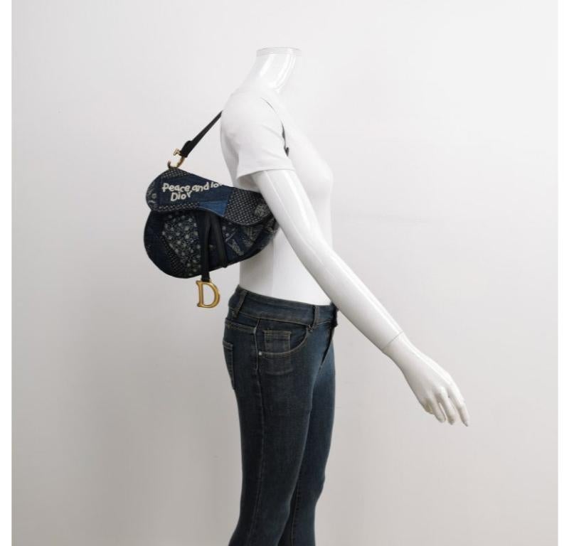 Dior saddle bag Special Edition Peace and Love Denim Patchwork Embroidery
These are professional photos of the actual bag.
  Make a bold statement with this one-of-a-kind, Special edition Dior Saddle Bag fully adorned with hand sewn glitter and