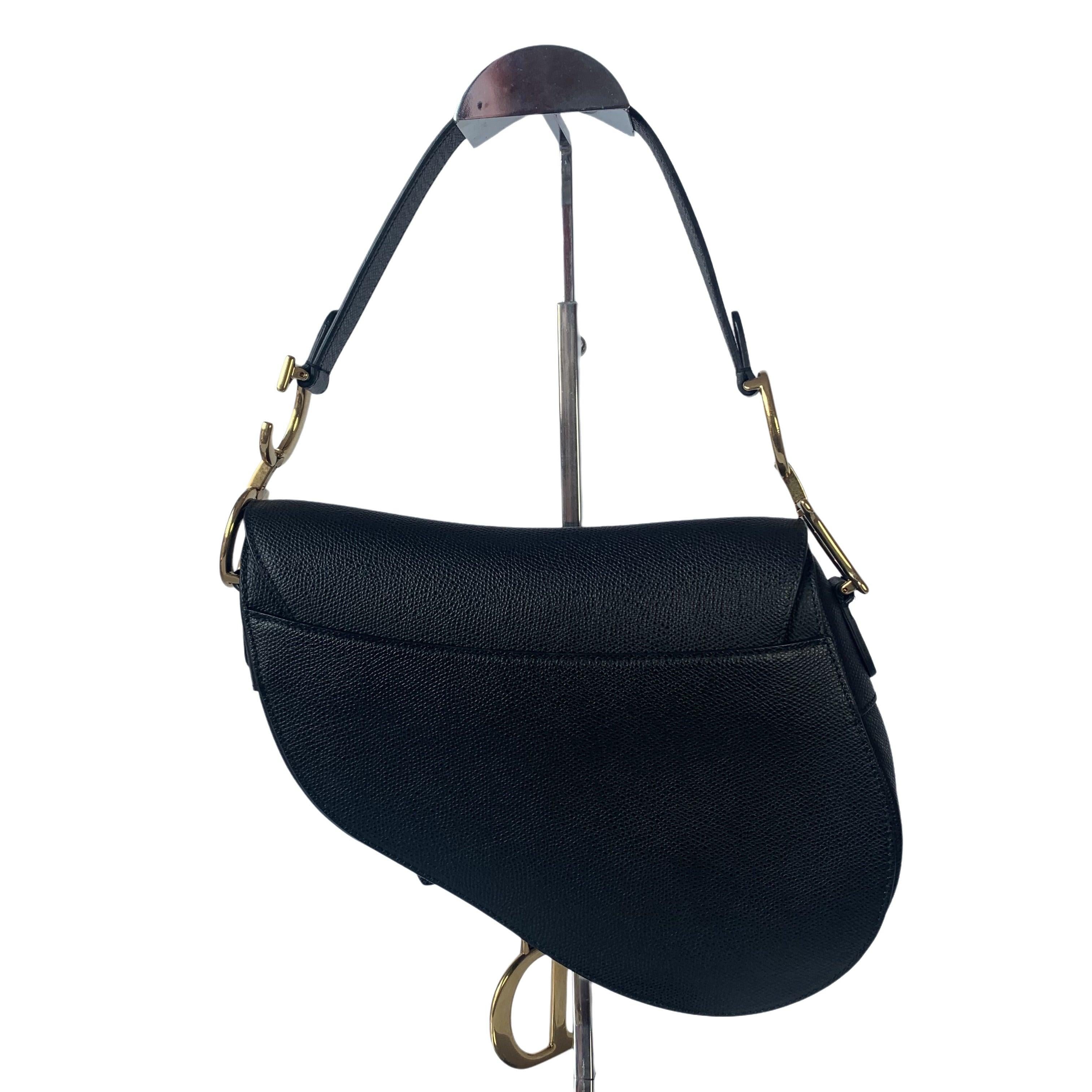 Dior Saddle Black Medium Grained Leather Handbag with Gold Hardware These are professional photos of the actual bag. 2018 Dior Saddle bag, crafted in black grained calfskin leather, the legendary design comes in size medium, features a magnetic
