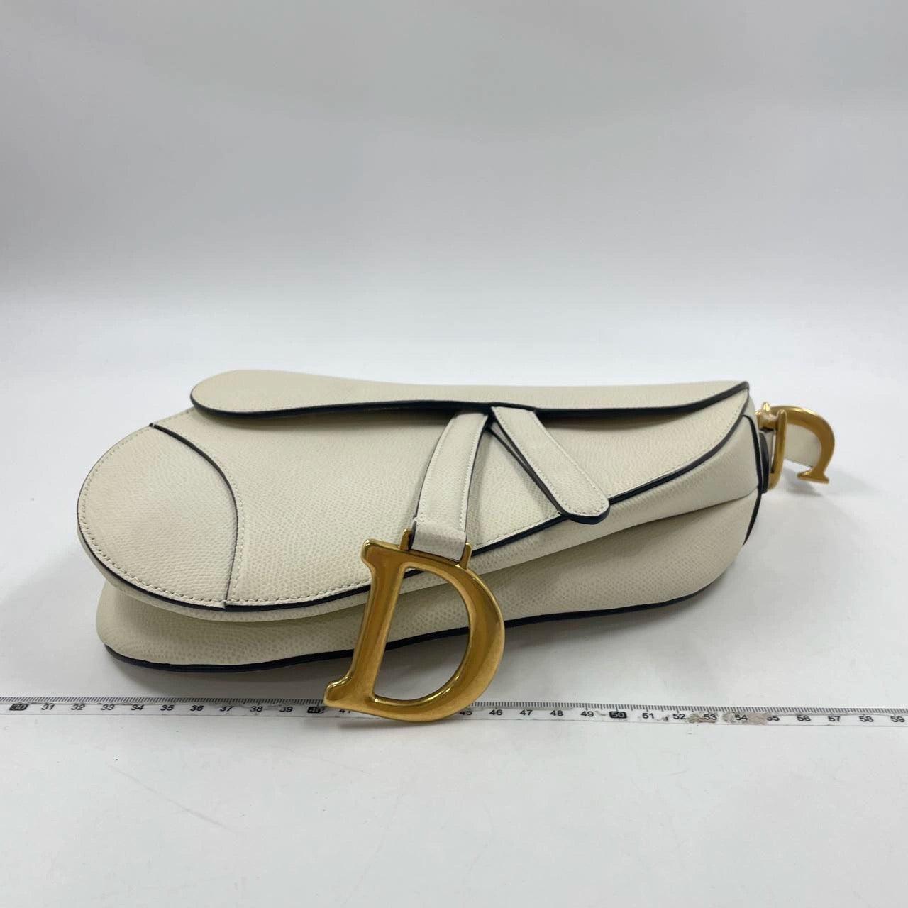 Dior Saddle Medium 2019 White Grained Leather Handbag
 These are professional photos of the actual bag offered by Luxbags.
 2019 Dior Saddle bag, crafted in white grained calfskin leather, the legendary design comes in size medium, features a