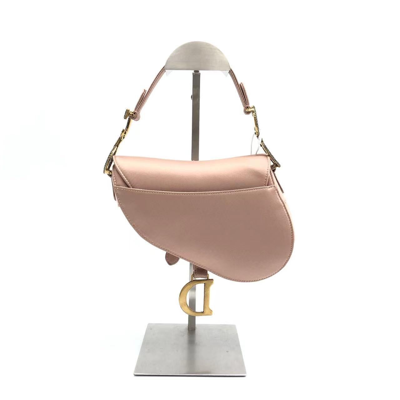 Dior Saddle Mini 2019 Silk Pink with Crystal Buckle Handbag
These are professional photos of the actual bag.
  Dior Saddle bag, crafted in pink silk satin, the legendary design comes in size mini, features a magnetic flap, and bedazzling crystal