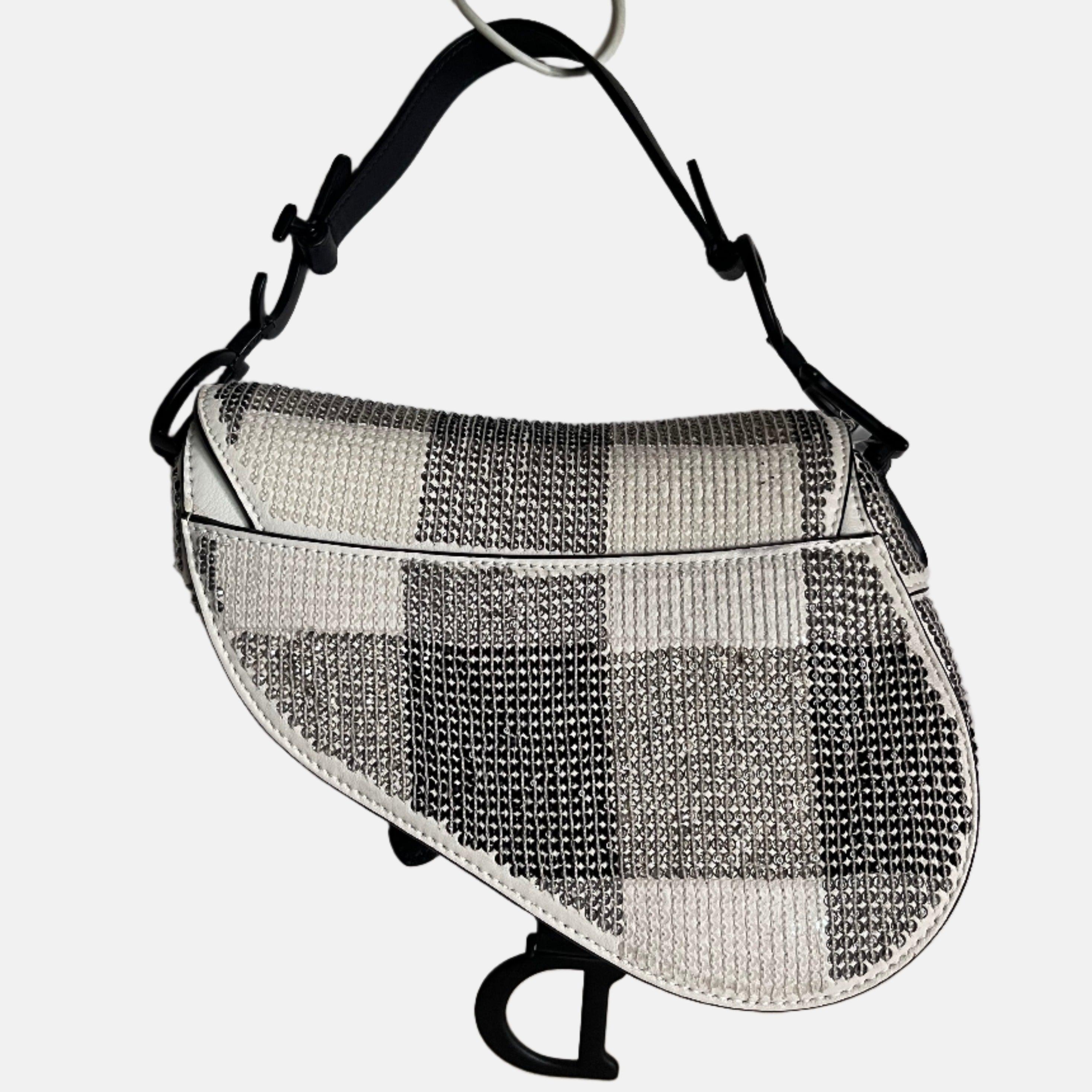 Dior Saddle Mini Beaded Black and White checkered Pattern These are professional photos of the actual bag. 2019 Dior Saddle bag, crafted in calfskin leather, adorned with mini sequins that make up the checkered design. Matte black CD signature on