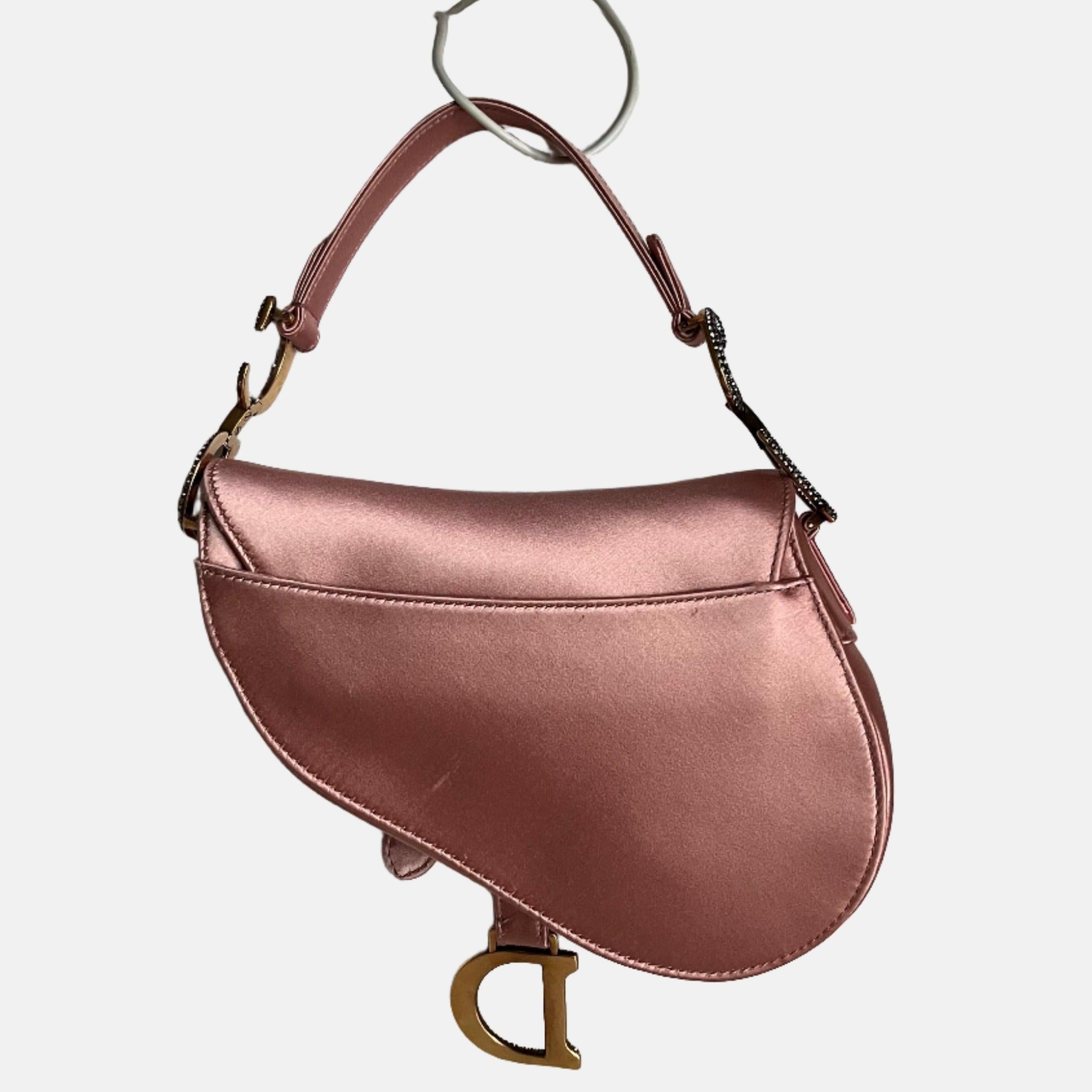 Dior Saddle Mini Silk 2019 Pink with crystals These are professional photos of the actual bag. 2019 Dior Saddle bag, crafted in pink silk satin, the legendary design comes in size mini, features a magnetic flap, and bedazzling crystal embellished CD
