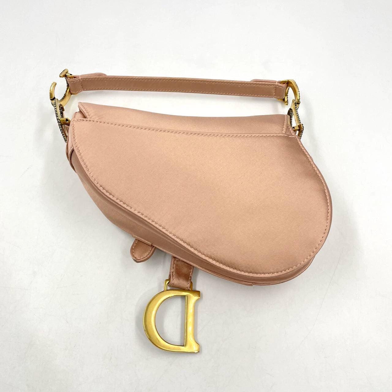 Dior Saddle Mini Silk Pink with crystals
These are professional photos of the actual bag.
  Dior Saddle bag, crafted in pink silk satin, the legendary design comes in size mini, features a magnetic flap, and bedazzling crystal embellished CD