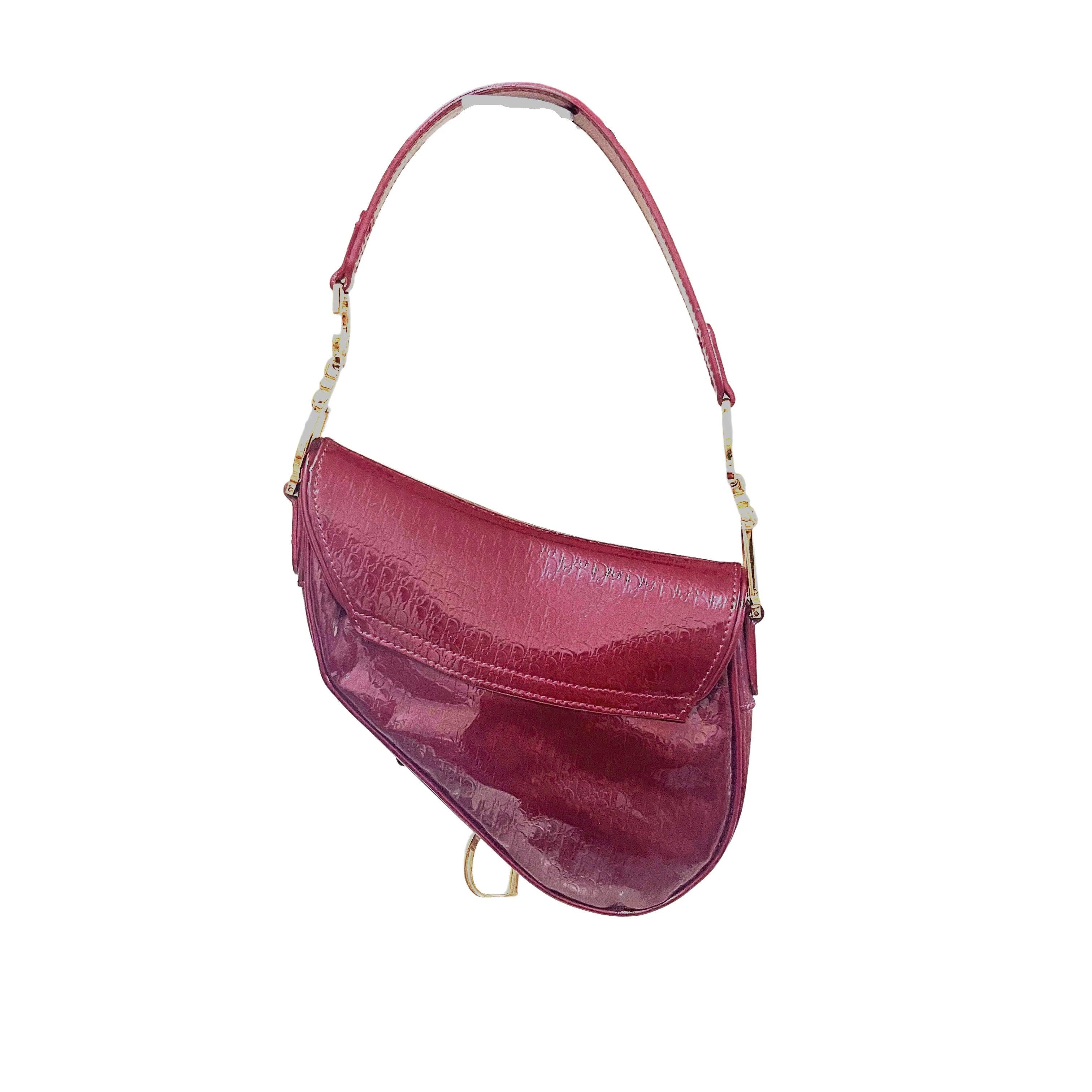Dior Saddle Mini Vintage Shoulder Bag Burgundy Patent Leather
 These are professional photos of the actual bag offered by Luxbags.
 This is a vintage style of the iconic dior Saddle bag designed by John Galliano. This one features burgundy color