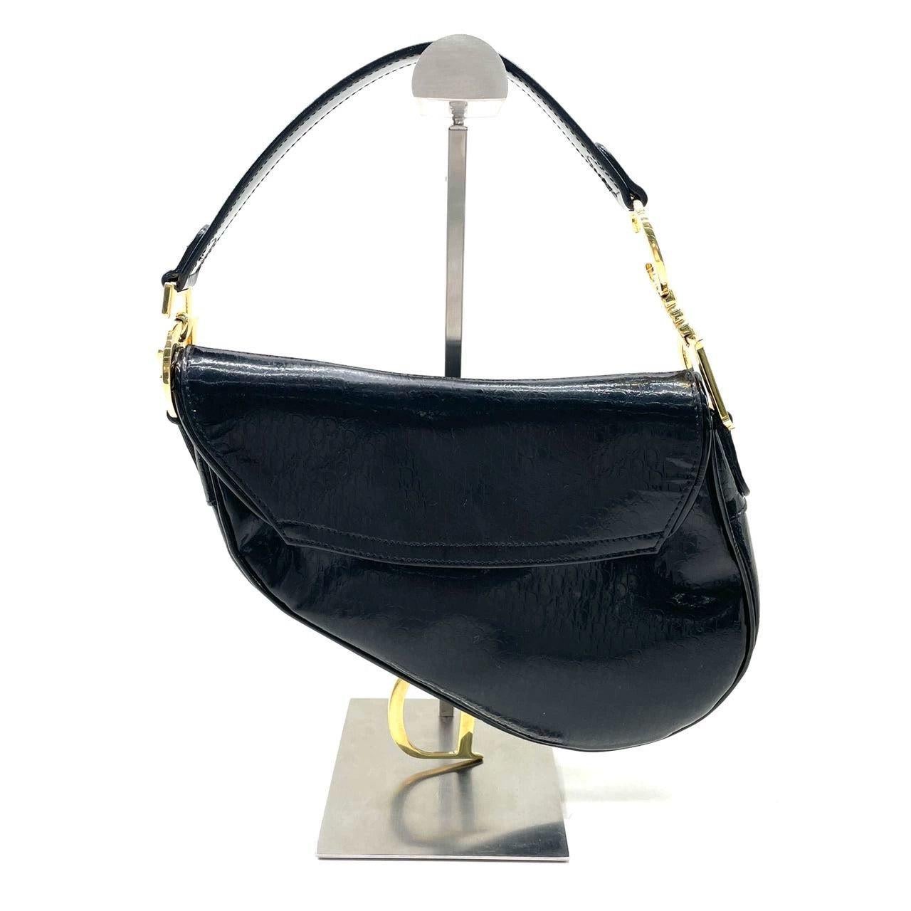 Dior Saddle Small Vintage Shoulder Bag Black Patent Leather
 These are professional photos of the actual bag offered by Luxbags.
 This is a vintage style of the iconic dior Saddle bag designed by John Galliano. This one features burgundy color