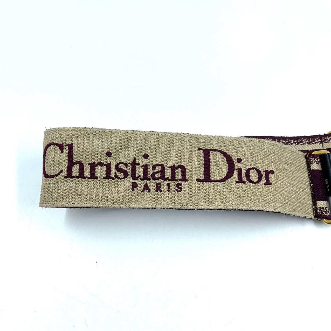 Dior Saddle Strap maroon canvas with Dior Logo
 These are professional photos of the actual bag offered by Luxbags.
 Can match any Dior handbag
 Like new
 Length: 95cm;Width: 6cm